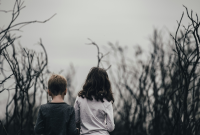 Two children near dormant trees